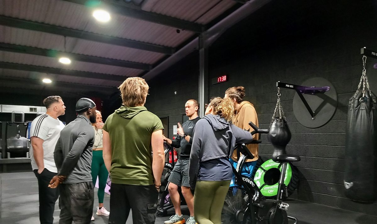 Course tutor coaching students at Wellbeing Fitness Education Centre, Towcester Northamptonshire